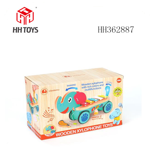 Wooden elephant playing piano with music, lighting, and electricity